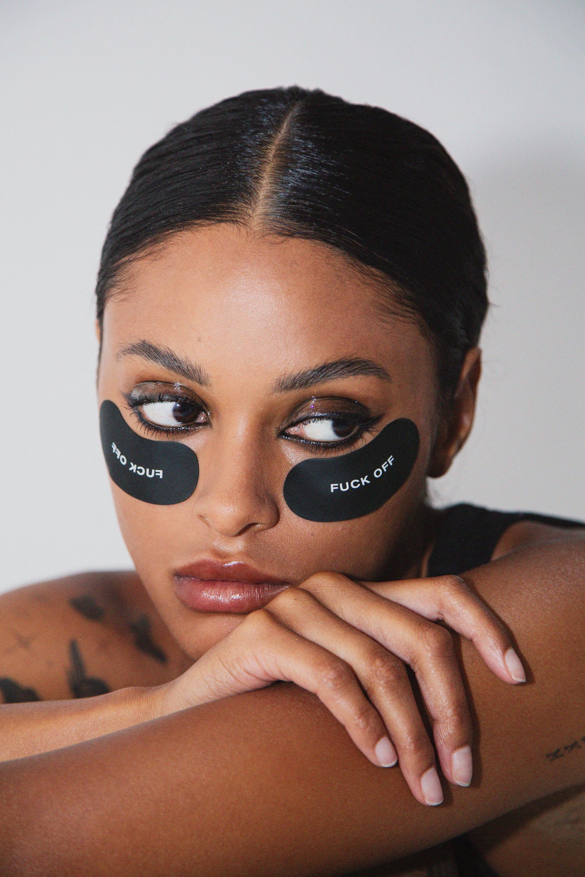 Luxury self-care moment with model wearing medical-grade silicone eye masks