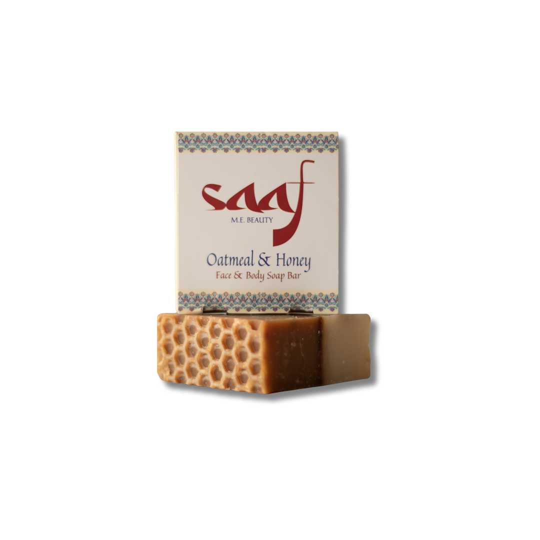 A bar of oatmeal and honey soap with a honeycomb pattern on the top, packaged in a card with the brand 'Saaf' and product name 'Oatmeal & Honey'.