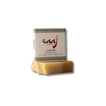 A bar of camel milk soap with a white and multicolor packaging that reads 'SAAF' and 'Camel Milk'.
