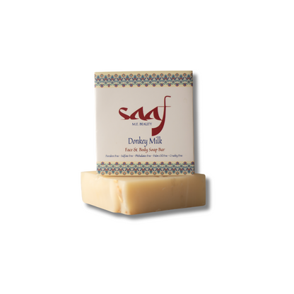 A packaged bar of Donkey Milk soap with the brand name SAAF visible on the label.