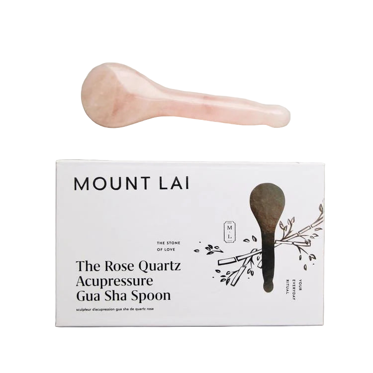 Mount Lai Rose Quartz Acupressure Gua Sha Spoon on a gray surface