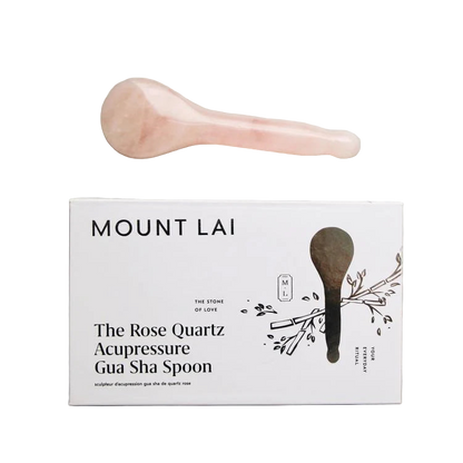 Mount Lai Rose Quartz Acupressure Gua Sha Spoon on a gray surface